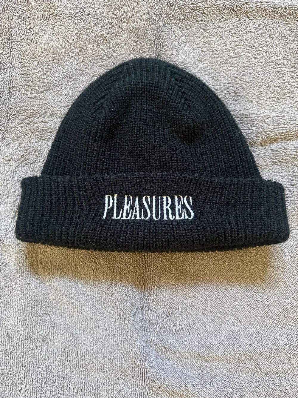 PLEASURES Black Knit Beanie with White Embroidered Logo